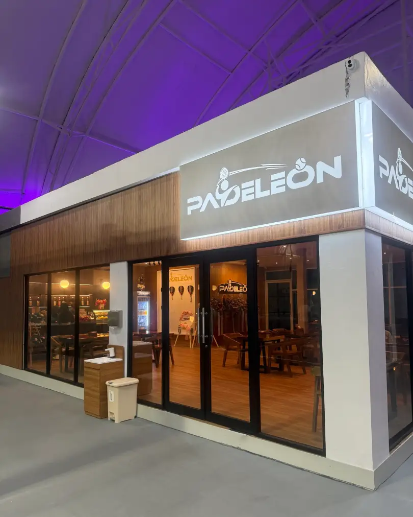 Padeleon entrance with lit sign