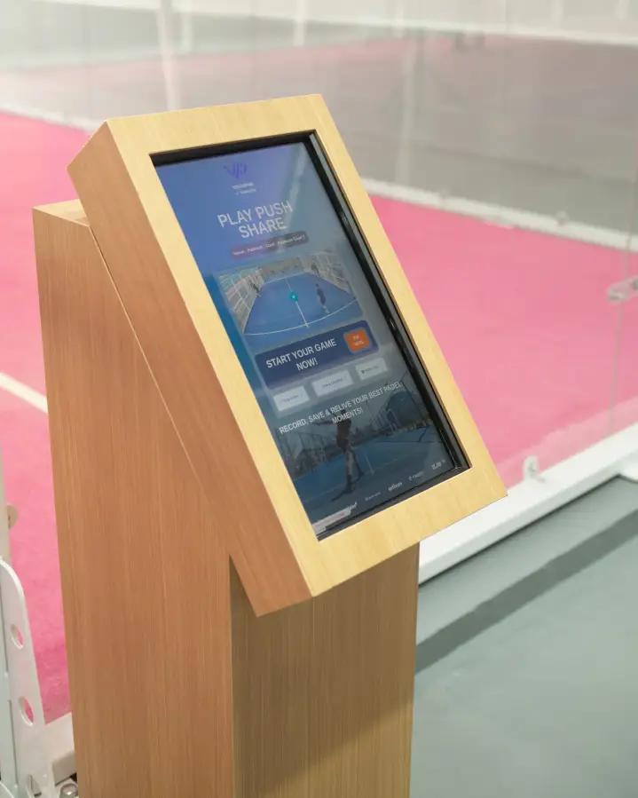 VisionPad screen beside the pink court